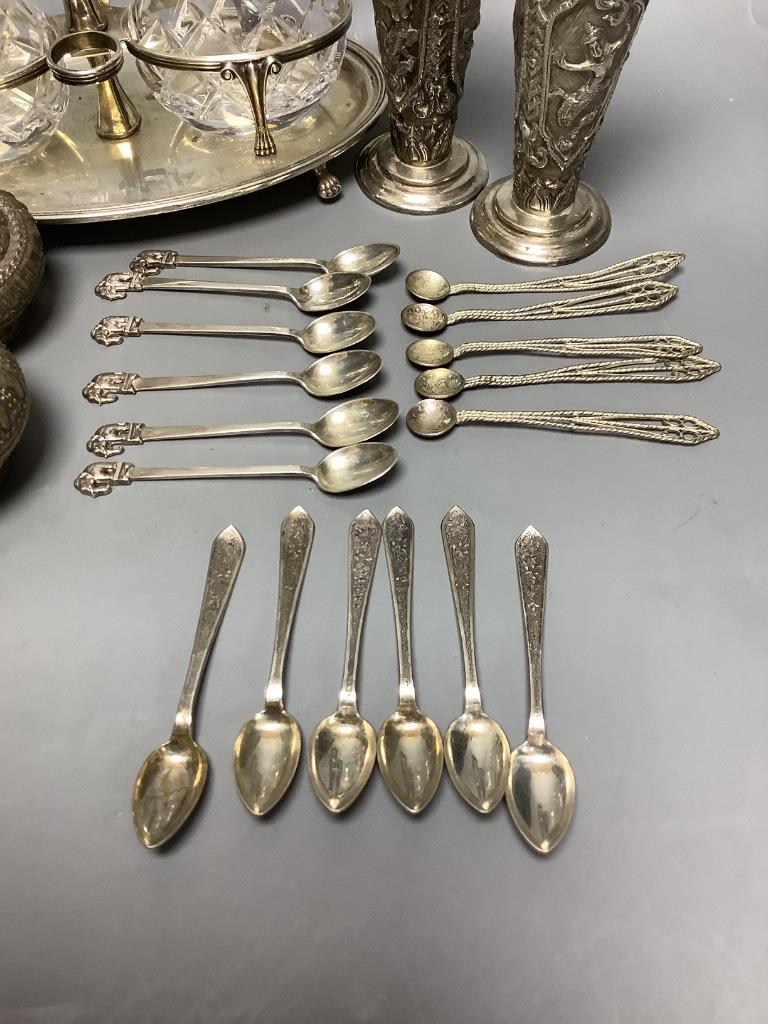 A pair of Thai Sterling silver specimen vases, a white metal ewer, a 'betel nut' box and cover, a set of silver teaspoons with elephant finials and sundries